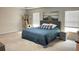 Cozy bedroom with a comfortable bed, soft carpeting, large windows, and a modern nightstand at 251 Turner Ln, Woodstock, GA 30188