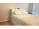 Cozy bedroom features a queen bed, built in shelving, and a soft, patterned quilt at 251 Turner Ln, Woodstock, GA 30188