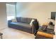 Bedroom with a neutral color scheme, versatile sofa bed, and functional desk area at 251 Turner Ln, Woodstock, GA 30188