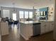Open-concept living area with a dining table, lots of natural light, a fireplace, and decorative shelves at 251 Turner Ln, Woodstock, GA 30188