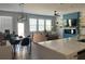 Open-concept living area boasts modern design, a dining area, and a stylish kitchen view at 251 Turner Ln, Woodstock, GA 30188