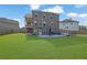 Expansive backyard featuring a patio, green lawn, and privacy fence at 5985 Hidden Ridge Ct, Cumming, GA 30028
