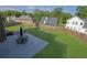 Aerial view of the backyard showing the patio, playset, and green lawn at 5985 Hidden Ridge Ct, Cumming, GA 30028