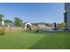 Spacious backyard featuring a playset, patio, and well-maintained lawn at 5985 Hidden Ridge Ct, Cumming, GA 30028
