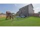 Large backyard with a playset, patio, and fencing, perfect for outdoor activities at 5985 Hidden Ridge Ct, Cumming, GA 30028