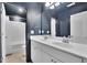 Bathroom with a double sink vanity and a shower at 5985 Hidden Ridge Ct, Cumming, GA 30028