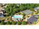 Aerial view of community pool, tennis courts, playground, and parking at 5985 Hidden Ridge Ct, Cumming, GA 30028