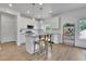 Bright kitchen featuring white cabinetry, granite countertops, and stainless steel appliances at 5985 Hidden Ridge Ct, Cumming, GA 30028