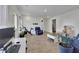 Open-concept living room with hardwood floors, and modern decor at 5985 Hidden Ridge Ct, Cumming, GA 30028