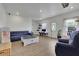 Spacious living room with hardwood floors, modern furniture, and plenty of natural light at 5985 Hidden Ridge Ct, Cumming, GA 30028