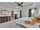 Spacious primary bedroom with an ensuite bathroom and large windows at 5985 Hidden Ridge Ct, Cumming, GA 30028