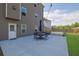 Relaxing patio area with outdoor seating and a view of the backyard at 5985 Hidden Ridge Ct, Cumming, GA 30028