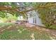 Spacious backyard with a large tree, a wood deck, and a glass patio door at 3311 Basking Shade Ln, Decatur, GA 30034