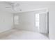 Bright bedroom featuring neutral walls, natural light from the window, and an open door at 3311 Basking Shade Ln, Decatur, GA 30034