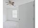 Bright bedroom featuring a ceiling fan and a window letting in natural light at 3311 Basking Shade Ln, Decatur, GA 30034