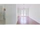 Dining area featuring glass doors, hardwood flooring, and a hanging chandelier above at 3311 Basking Shade Ln, Decatur, GA 30034
