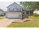 Charming two-story home featuring a garage and inviting front steps leading to the front door at 3311 Basking Shade Ln, Decatur, GA 30034