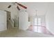 Open-concept living space with staircase, hardwood flooring and glass doors leading to outdoor space at 3311 Basking Shade Ln, Decatur, GA 30034