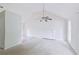 Bright living room featuring high ceilings, a ceiling fan, fireplace and neutral decor at 3311 Basking Shade Ln, Decatur, GA 30034