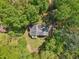 Aerial view of the property showcasing lush greenery and surrounding treed landscape at 4315 Hickory Point Dr, Canton, GA 30115