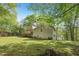 Lush backyard with mature trees, offering ample space for outdoor activities and relaxation at 4315 Hickory Point Dr, Canton, GA 30115