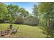 Spacious backyard with a fire pit and adirondack chairs, perfect for outdoor enjoyment at 4315 Hickory Point Dr, Canton, GA 30115