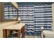 Charming bathroom with a stylish vanity, mirror, and blue-and-white striped shower curtain for a fresh look at 4315 Hickory Point Dr, Canton, GA 30115