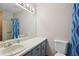 Functional bathroom with clean lines, vanity and shower-tub combo with neutral finishes at 4315 Hickory Point Dr, Canton, GA 30115