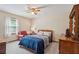 Cozy bedroom featuring a ceiling fan, neutral walls, and comfortable furnishings, creating a relaxing atmosphere at 4315 Hickory Point Dr, Canton, GA 30115