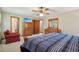 Spacious bedroom with a queen bed, dresser, and a view into the ensuite bathroom at 4315 Hickory Point Dr, Canton, GA 30115