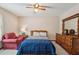 Bright bedroom featuring a queen bed, dresser and accents chair at 4315 Hickory Point Dr, Canton, GA 30115
