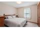 Cozy bedroom with neutral walls, queen size bed, and ample storage space at 4315 Hickory Point Dr, Canton, GA 30115