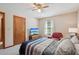 Inviting bedroom with a plush armchair, TV, and a calming color palette for a restful retreat at 4315 Hickory Point Dr, Canton, GA 30115