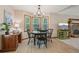 Cozy dining area featuring a round table, chandelier, and large bay windows for ample natural light at 4315 Hickory Point Dr, Canton, GA 30115