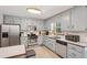 Well-lit kitchen with stainless steel appliances and neutral cabinetry at 4315 Hickory Point Dr, Canton, GA 30115