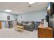 Bright living room featuring a cozy sofa, light-colored flooring, and ample space for relaxation at 4315 Hickory Point Dr, Canton, GA 30115