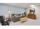 Relaxing living room with a comfortable sofa, wooden accents, and a well-lit space for entertainment at 4315 Hickory Point Dr, Canton, GA 30115