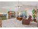 Cozy living room features a stone fireplace, neutral carpet, and ample seating at 4315 Hickory Point Dr, Canton, GA 30115