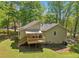 The backyard features a wooden deck perfect for enjoying the outdoors and entertaining guests at 4315 Hickory Point Dr, Canton, GA 30115