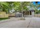 Spacious backyard with a stone patio, a gray house with multiple windows, and wooden fences at 1463 Metropolitan Sw Pkwy, Atlanta, GA 30310