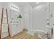 Stylish bathroom with a walk-in shower, modern vanity, and decorative ladder for towels at 1463 Metropolitan Sw Pkwy, Atlanta, GA 30310