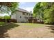 Large backyard with a wood fence provides privacy and space for outdoor activities at 2975 Oak Hampton Way, Duluth, GA 30096