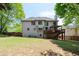Expansive backyard features a wooden deck, mature trees, and a privacy fence at 2975 Oak Hampton Way, Duluth, GA 30096