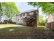View of the large backyard showcasing the deck and ample green space for outdoor enjoyment at 2975 Oak Hampton Way, Duluth, GA 30096