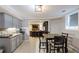 Finished basement with dining area, kitchenette, and living space with bar seating for entertaining at 2975 Oak Hampton Way, Duluth, GA 30096