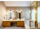 Bathroom featuring dual sinks, a soaking tub, shower, and ample counter space at 2975 Oak Hampton Way, Duluth, GA 30096