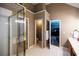 Bathroom showcasing walk-in shower, tile flooring, and access to the main bedroom at 2975 Oak Hampton Way, Duluth, GA 30096