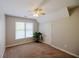 Bedroom featuring neutral walls, carpet, natural light, ceiling fan, and closet at 2975 Oak Hampton Way, Duluth, GA 30096