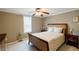 Comfortable bedroom featuring neutral walls, a ceiling fan, and coordinated decor for a relaxing retreat at 2975 Oak Hampton Way, Duluth, GA 30096