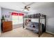 Bedroom with a bunk bed, carpet, window, ceiling fan and wooden dresser at 2975 Oak Hampton Way, Duluth, GA 30096